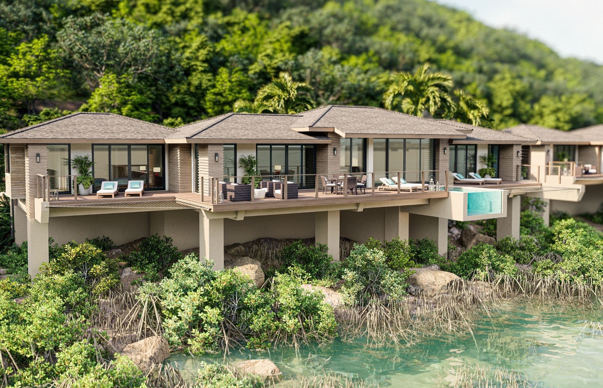 A luxurious, modern villa with an elevated, expansive deck featuring lounge chairs, a dining area, and an infinity pool. The Ocean Villa overlooks a lush, green forest and is situated just above a serene body of water surrounded by mangrove trees.