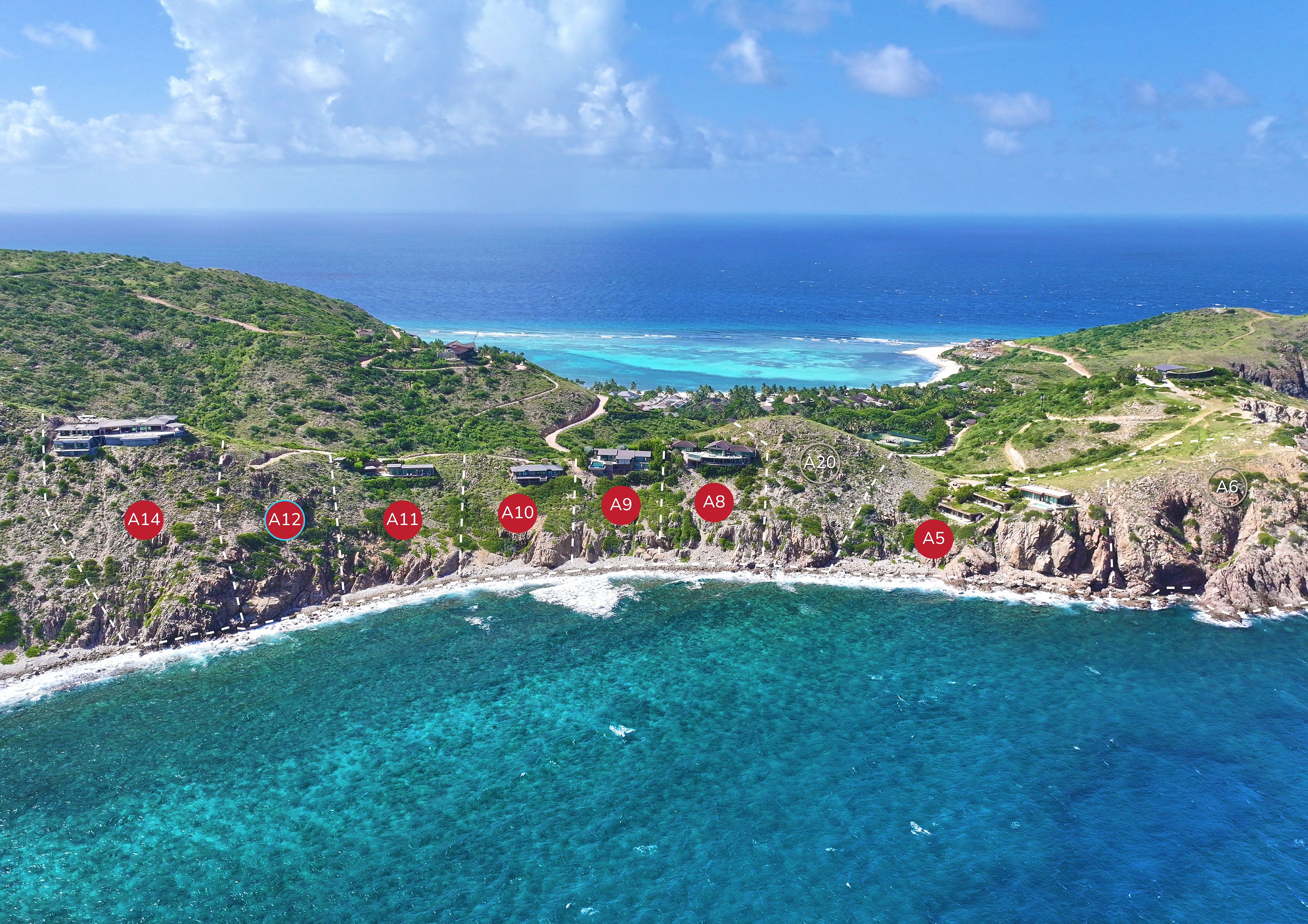 A coastal aerial view showcases a series of properties dotting the rocky shoreline of Atlantic Ridge, each marked with red labels from A5 to A14. The clear blue ocean and lush green hills add to the stunning background.