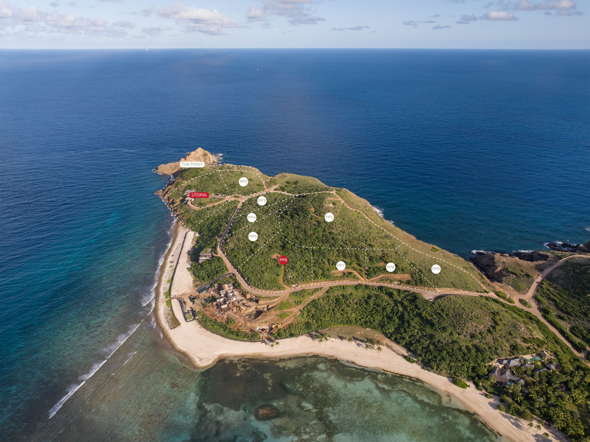 Aerial view of a small coastal area with lush green hills, sandy beaches, clear blue water, and a few scattered buildings. Dotted lines and numbered markers indicate different points of interest across the landscape, including Pajaros Point.